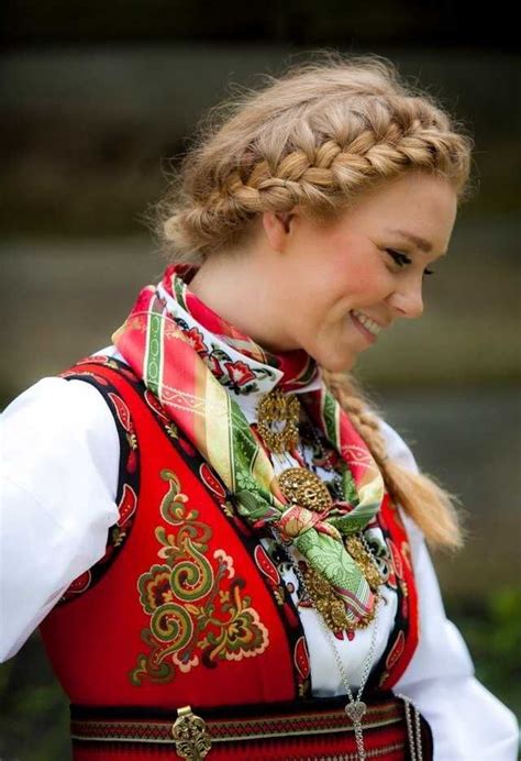 A Woman Wearing A Red Vest And Braid