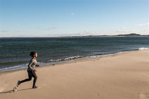 Woman Jogging On Beach Newburyport Photograph By Joe Klementovich