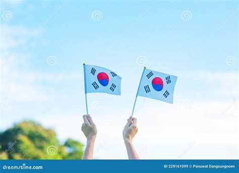 Hand Holding Korea Flag On Nature Background National Foundation