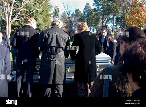 Grievers mourning in funeral at Acacia Cemetery. Mendota Heights
