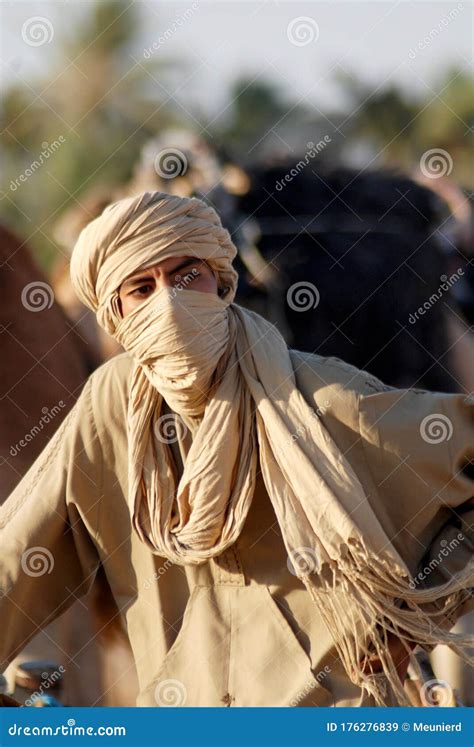 An Unidentified Bedouin Man Wears Traditional Clothing In Sahara Desert