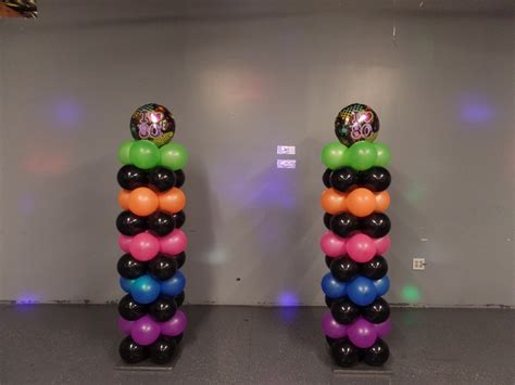 80 S Theme Balloon Columns Using Black And Neon Balloons Glow Pool Parties Disco Theme Parties