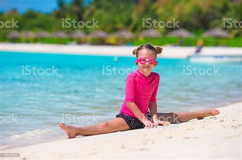Adorable Little Girl At Beach During Summer Vacation Stock Photo