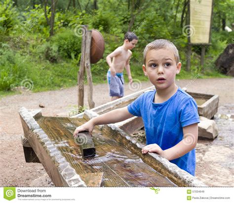 Children Playing With Water In Park Stock Image Image Of