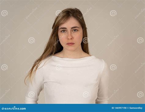 Portrait Of Sad And Intimidated Woman Isolated In White Background