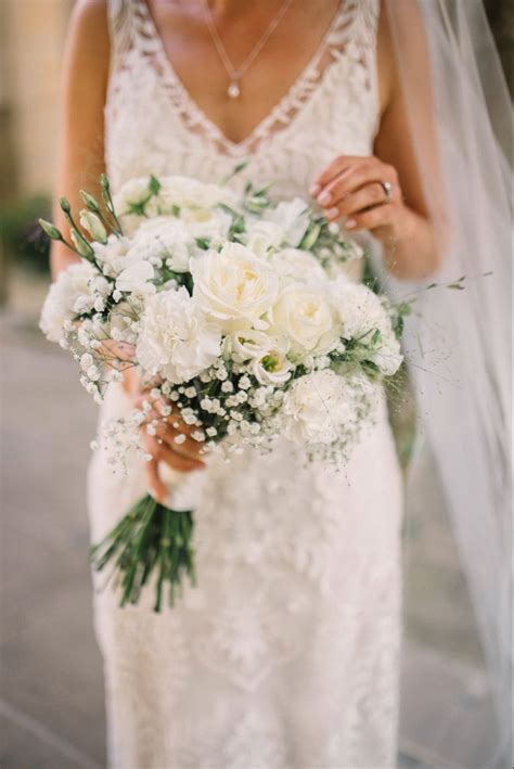 bridal bouquet with white roses and gypsophila in 2022 white bridal bouquet white rose