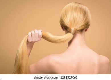 Back View Of Naked Blonde Girl With Long Straight Hair Isolated On