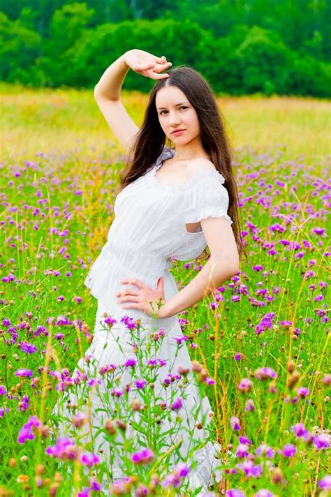 Beautiful Woman Posing In A Field With Flowers Stock Photo Image Of