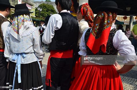 Dancers In Traditional Portuguese Dress Prepare To Take Part In Folk
