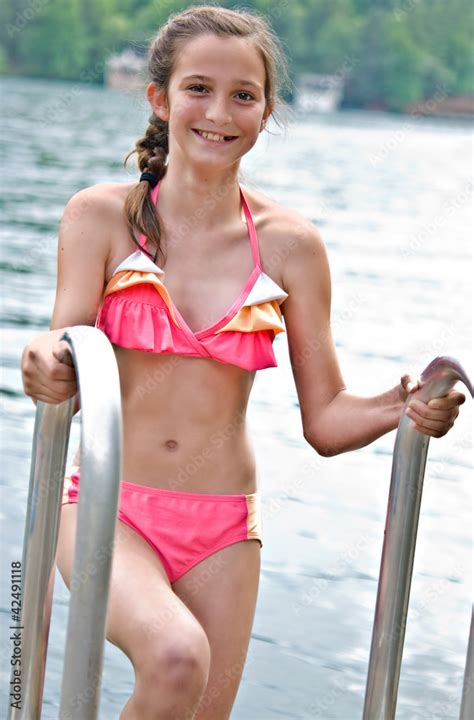 Preteen Girl At The Lake Stock Photo Adobe Stock