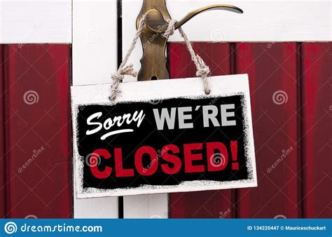 Sign Of Wood Hanging On A Door Handle With Sorry Were Closed Stock