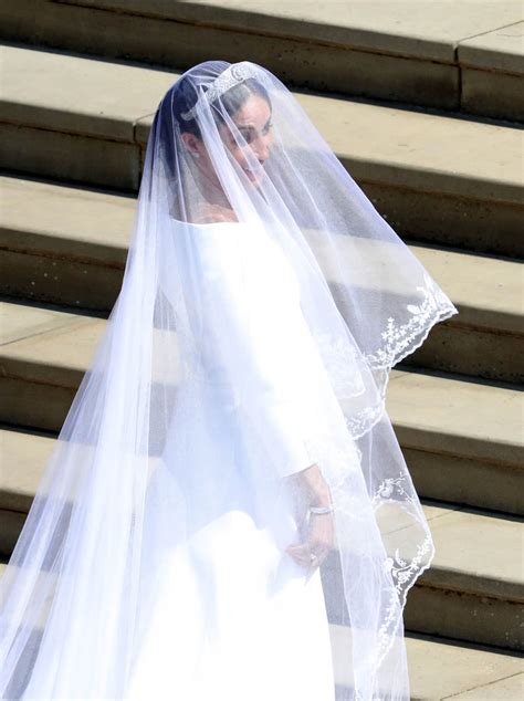 How meghan markle changed her engagement ring after royal wedding anniversary. Meghan Markle arrives at Windsor Castle to marry Prince Harry