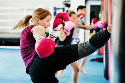 Group Of Women Kickboxing Together At Gym Stock Photo Download Image