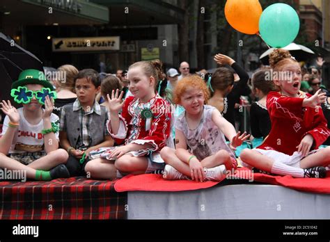 Irish Children On A Float Wave To People Watching The St Patricks Day
