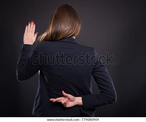 Woman Fingers Crossed Behind Her Back