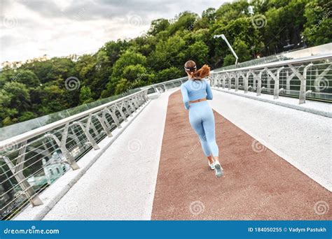 Beautiful Sporty Young Woman Running Over Bridge Stock Image Image Of