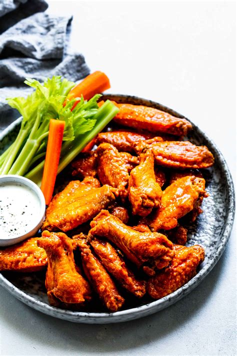 Oven Baked Buffalo Wings Cook Up Amazingly Crispy And Juicy Without Deep Frying Then Theyre