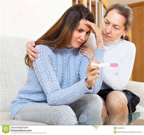 Mother Hugging Her Sad Daughter With A Pregnancy Test Stock Photo Image Of House Pregnancy