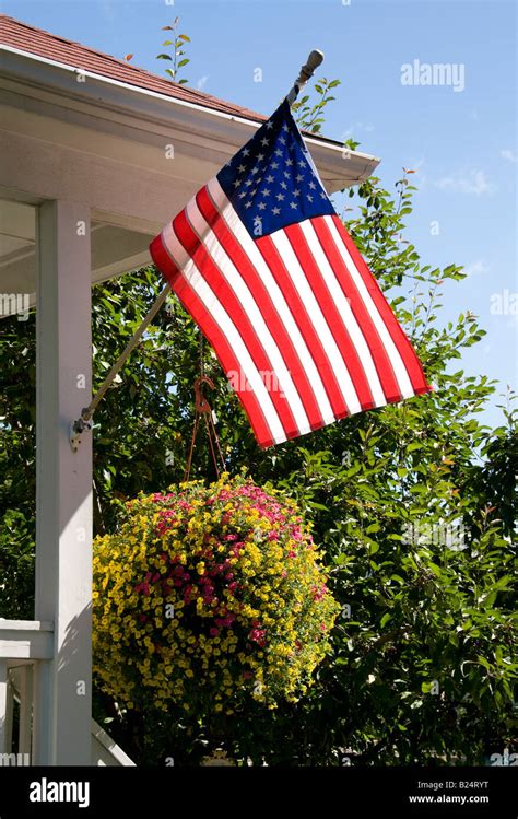 Patriotic Home Displaying American Flag On Patio Stock Photo Alamy
