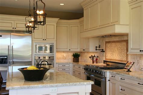 For a long time, white kitchen cabinets have been listed as a favorite feature in the cooking space. Antique Cream Glazed Cabinets with quartz countertops ...