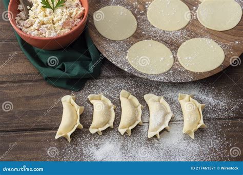 Process Of Making Empanadas Or Capelets Of Ricotta Ham Cheese And