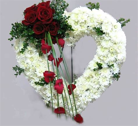 Fully Decorated Striking Open Funeral Heart Arrangement With White And