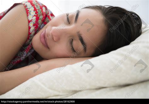 Sleeping Woman Lying Down On Bed Lizenzfreies Foto 28162900