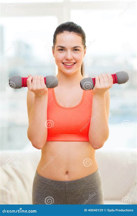 Smiling Teenage Girl Exercising With Dumbbells Stock Image Image Of