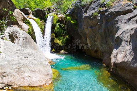 Beautiful Waterfall On Mountain River With Turquoise Water Stock Photo