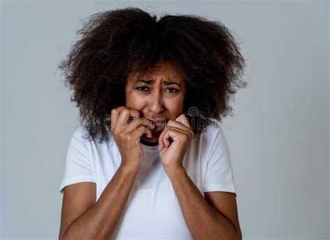 Young Attractive African American Woman Looking Scared And Shocked