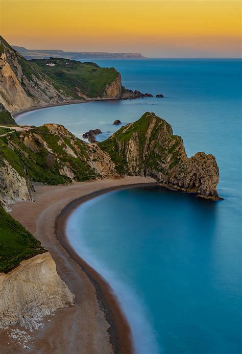 Sunset At Durdle Door In England Photograph By George Afostovremea