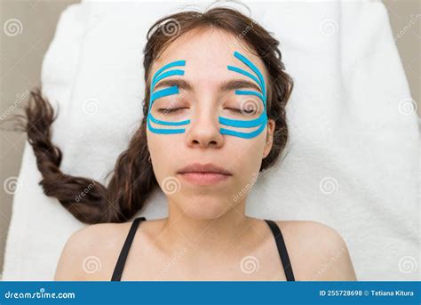 Facial Tape Close Up Of A Girl`s Face With An Anti Wrinkle Cosmetology