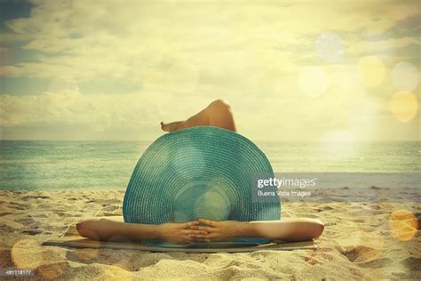 Young Woman Lying On The Beach Photo Getty Images