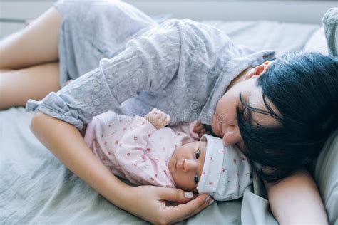A Mother`s Daytime Sleep With Her Newborn Baby Stock Photo Image Of