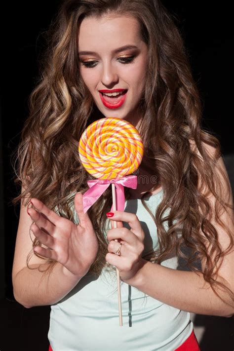 Beautiful Fashionable Woman Eats Candy Big Sweet Lollipop Stock Photo