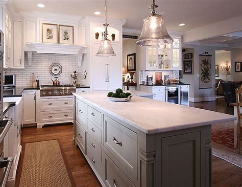 Cabinets and appliances spread out against two adjoining walls to form an l. L Shaped Island - Traditional - kitchen - Pheasant Hill Design | Kitchen cabinets grey and white ...