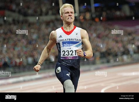 Jonnie Peacock Of Gb Celebrates Winning The Gold Medal In The Mens