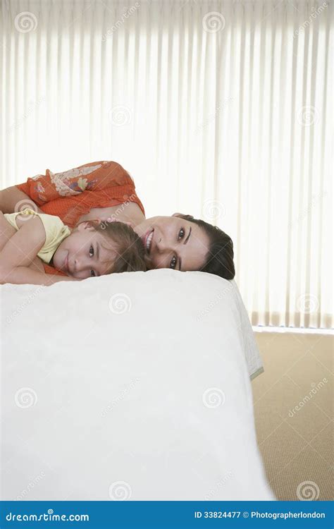 Mother And Daughter Relaxing In Bed Stock Image Image Of Lying Home 33824477