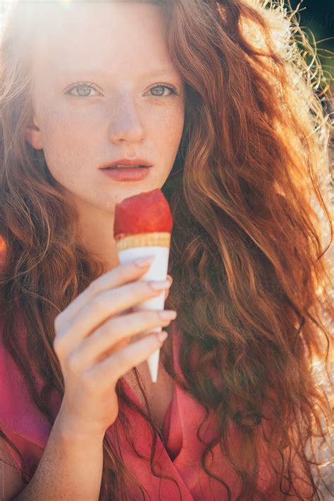 Beautiful Redhead Eating Raspberry Ice Cream By Stocksy Contributor Lumina Stocksy