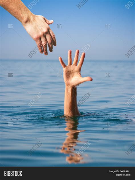Helping Hand Giving Drowning Man Image And Photo Bigstock