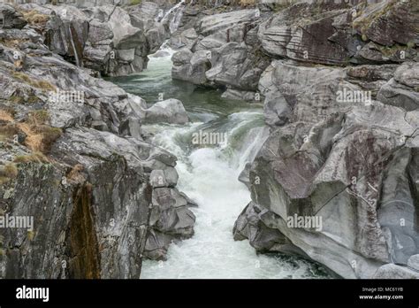 Fantastic View Of A Mountain River Carving Ist Way Through A Wild Rocky