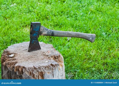 Old Vintage Axe Is Stuck In A Piece Of Log Wood Stock Photo Image Of