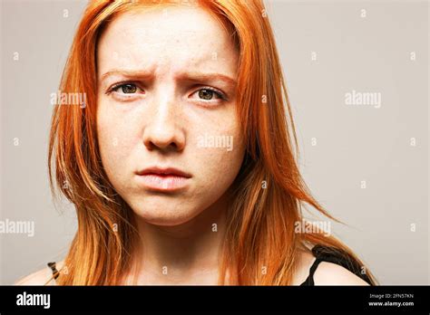 Beautiful Fragile Redheaded Young Woman In The Dark Sad Frightened