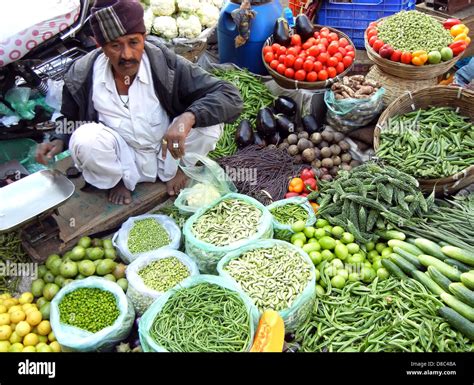 Indian Street Vendor Selling Selling Fresh Vegetables And Fruits In