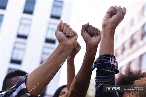 Raised Fists Of Diverse Male And Female Protesters Demonstrating On
