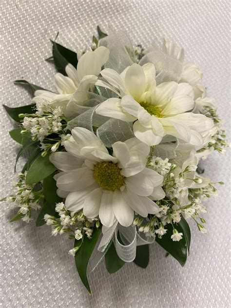 Wrist Corsage Of White Daisies In East Rochester Ny The Flower Shop