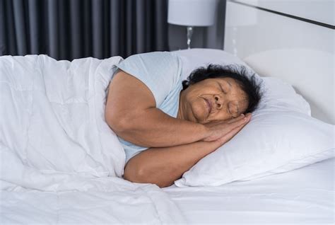 Premium Photo Old Woman Sleeping On A Bed
