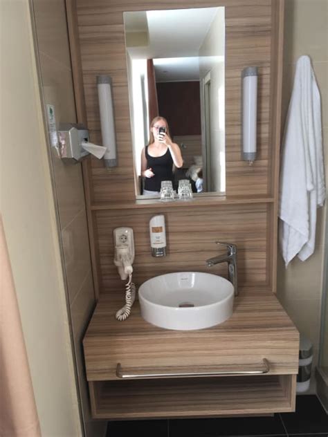 Business guests enjoy the breakfast. "Bad" Star G Hotel Premium Dresden im Haus Altmarkt ...