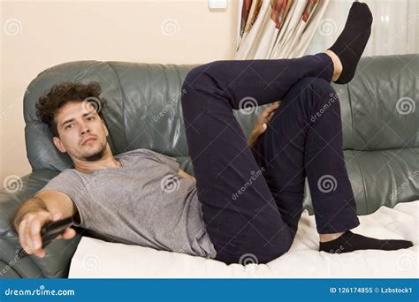 Lazy Man With The Remote On The Couch Stock Image Image Of Addiction Laziness 126174855