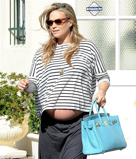 a very pregnant molly sims looks ready to pop as she shows off her burgeoning belly daily mail